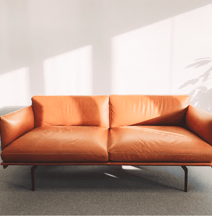 a modern orange leather couch