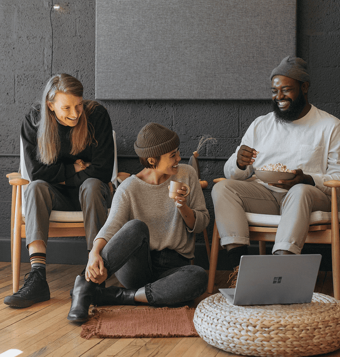 group of three friends handing out in a stylish urban living room